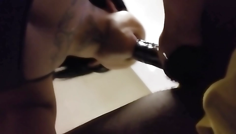 Ebony chick with a sexy tattooed pussy is on stick