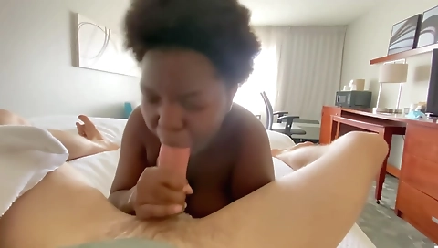Ebony girl is giving her hotel head a good blowjob