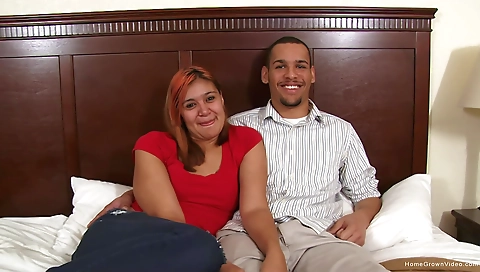 Ebony teen plays with his big black cock in the living room