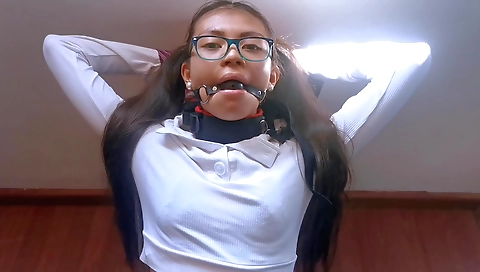 Ebony babe gets fucked and gags on a dildo in bondage