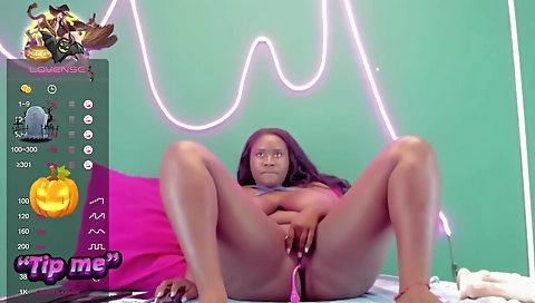 Ebony babe wearing pink lingerie is playing solo online