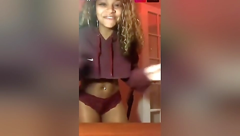 Busty ebony babe with round ass moves around on webcam