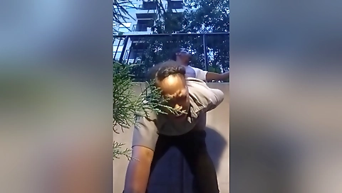 Security guard's sexy body is on the street outdoors