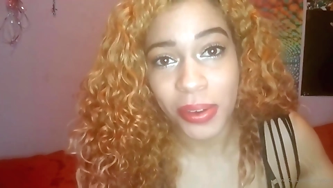 Ebony redhead plays with a homemade toy in solo video