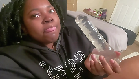 Ebony girl with a nice hairy pussy plays with a toy