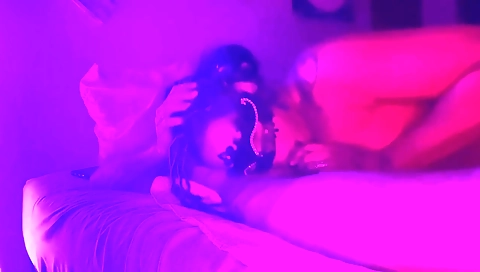 A busty black woman with a tattooed ass sucks a big cock