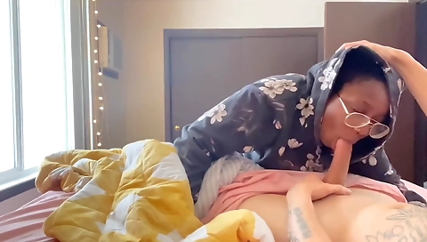 Mature brunette and ebony lady are playing with a toy